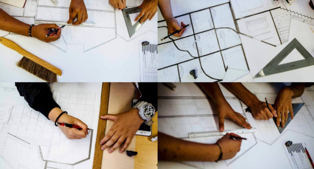 Image of four studio desks with the hands of Design Discovery Youth participants drawing plans and sections of architecture on paper.  